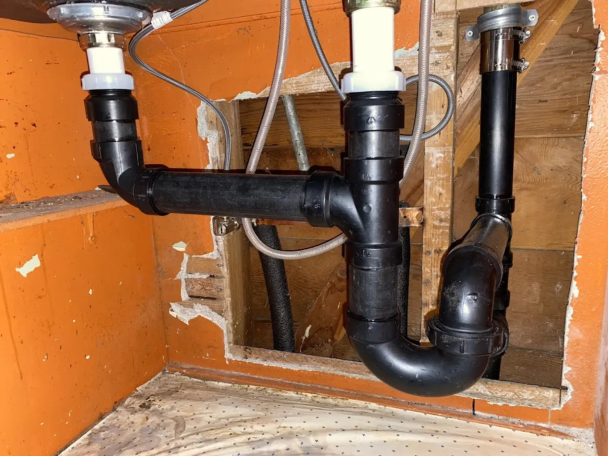 Professional Garbage Disposal Repair equipment and tools on the job in California